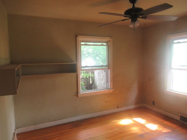 211 South Lafayette Street Byron, IL 61010 - Photo 13 of 26 an empty room with a window