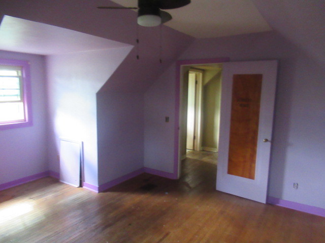 211 South Lafayette Street Byron, IL 61010 - Photo 19 of 26 an empty room with windows