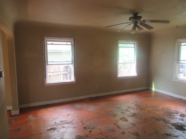 211 South Lafayette Street Byron, IL 61010 - Photo 2 of 26 a view of an empty room with a window