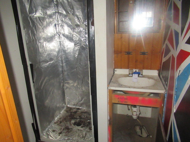 211 South Lafayette Street Byron, IL 61010 - Photo 23 of 26 a bathroom with a sink and mirror