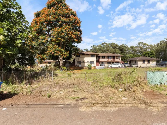 a view of street with parked cars