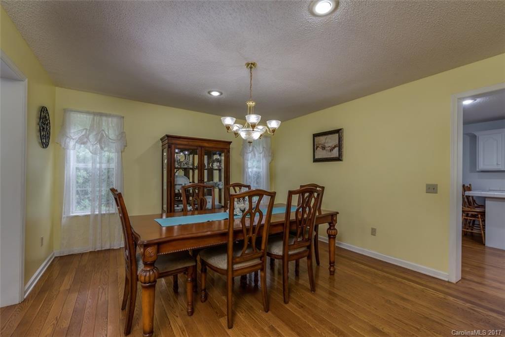 220 Collins Road Forest City, NC 28043 - Photo 8 of 24 a view of a dining room with furniture and wooden floor