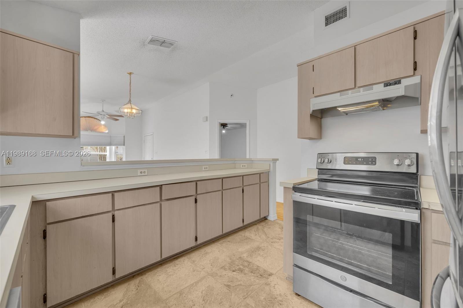 331 San Gabriel Street Winter Springs, FL 32708 - Photo 12 of 26 a kitchen with cabinets appliances and a counter space