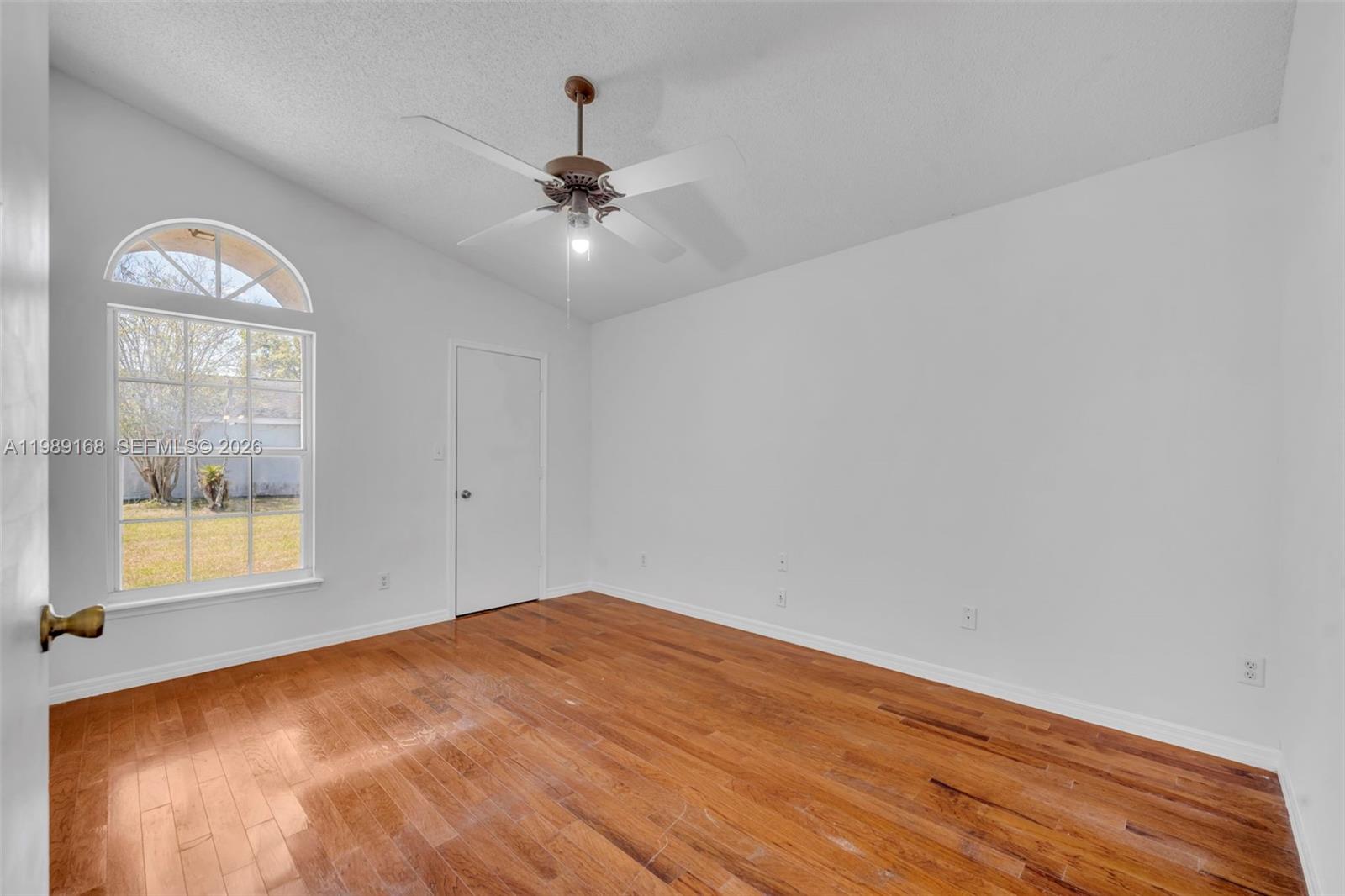 331 San Gabriel Street Winter Springs, FL 32708 - Photo 14 of 26 wooden floor in an empty room with a window