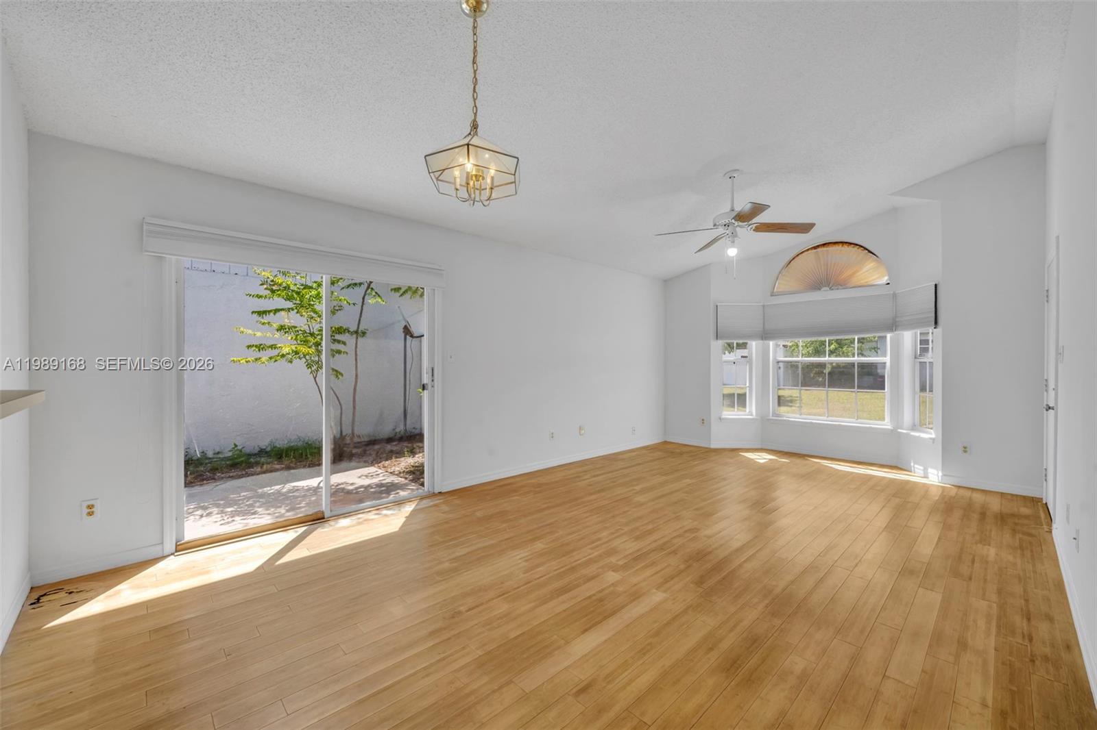 331 San Gabriel Street Winter Springs, FL 32708 - Photo 6 of 26 a view of an empty room with window and wooden floor