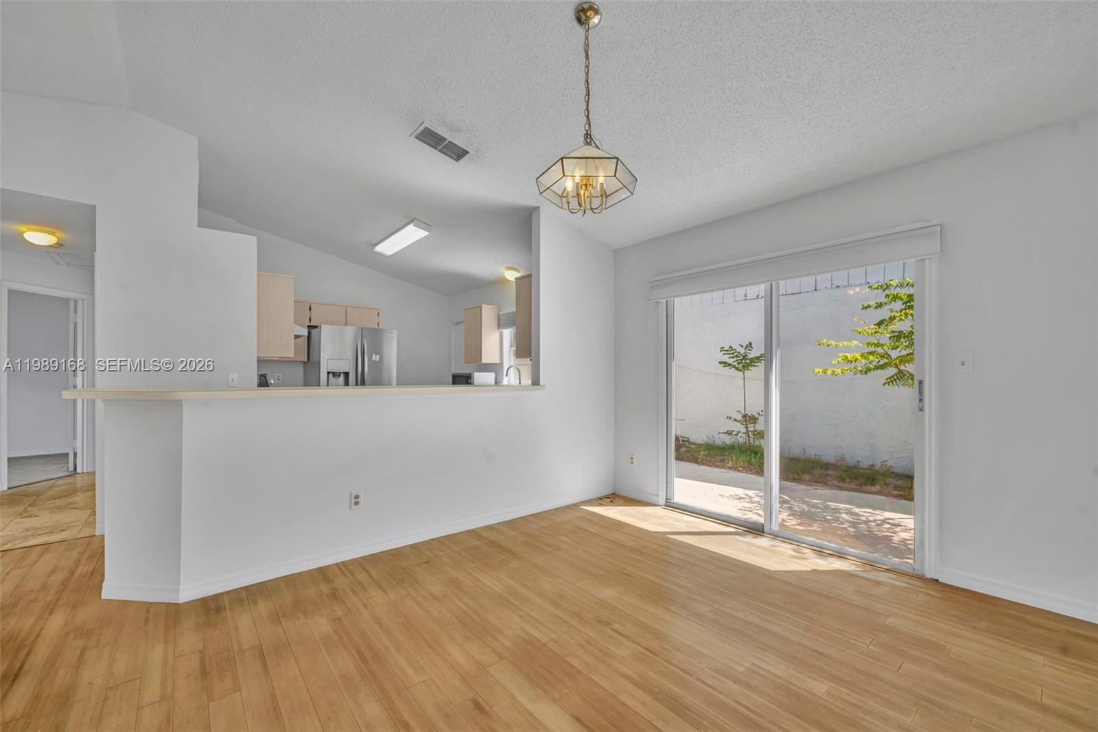 331 San Gabriel Street Winter Springs, FL 32708 - Photo 9 of 26 a view of a room with wooden floor and a ceiling fan