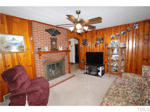 4317 Kerley Road Durham, NC 27705 - Photo 6 of 25 The Living Room also has a Masonry Wood Burning Fireplace with Mantle.