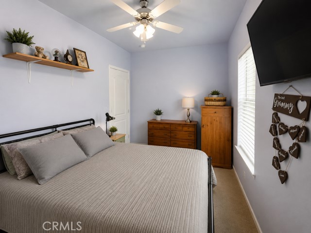 28820 Memory Winchester, CA 92596 - Photo 9 of 18 a bedroom with bed and window