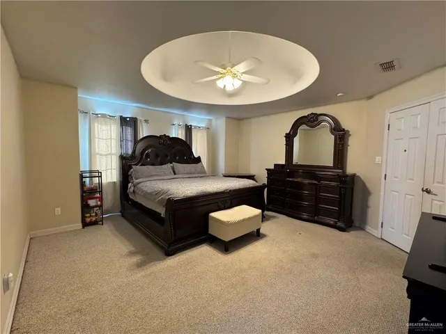 a living room with furniture and a mirror