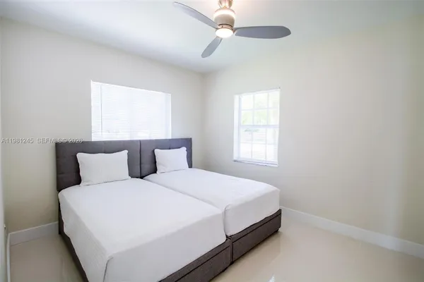 a bedroom with a bed and window