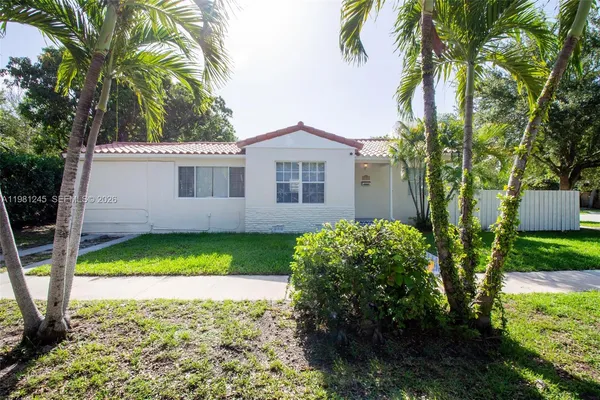 a house with a tree in front of it
