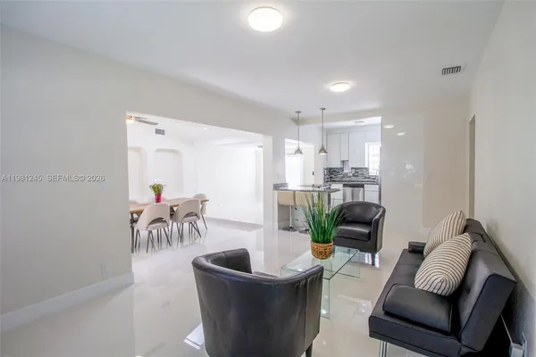 a living room with furniture and a table