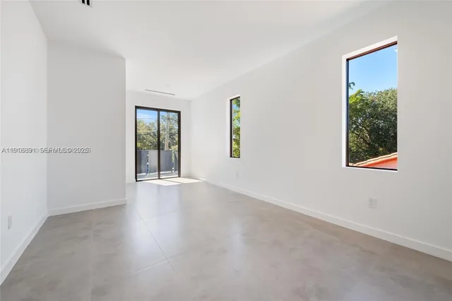 an empty room with windows