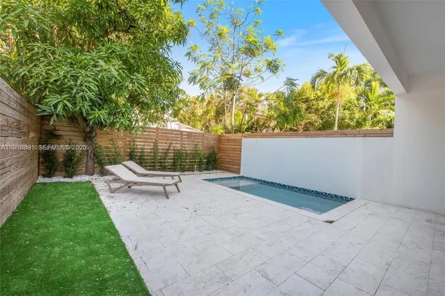 a view of a bench in a backyard