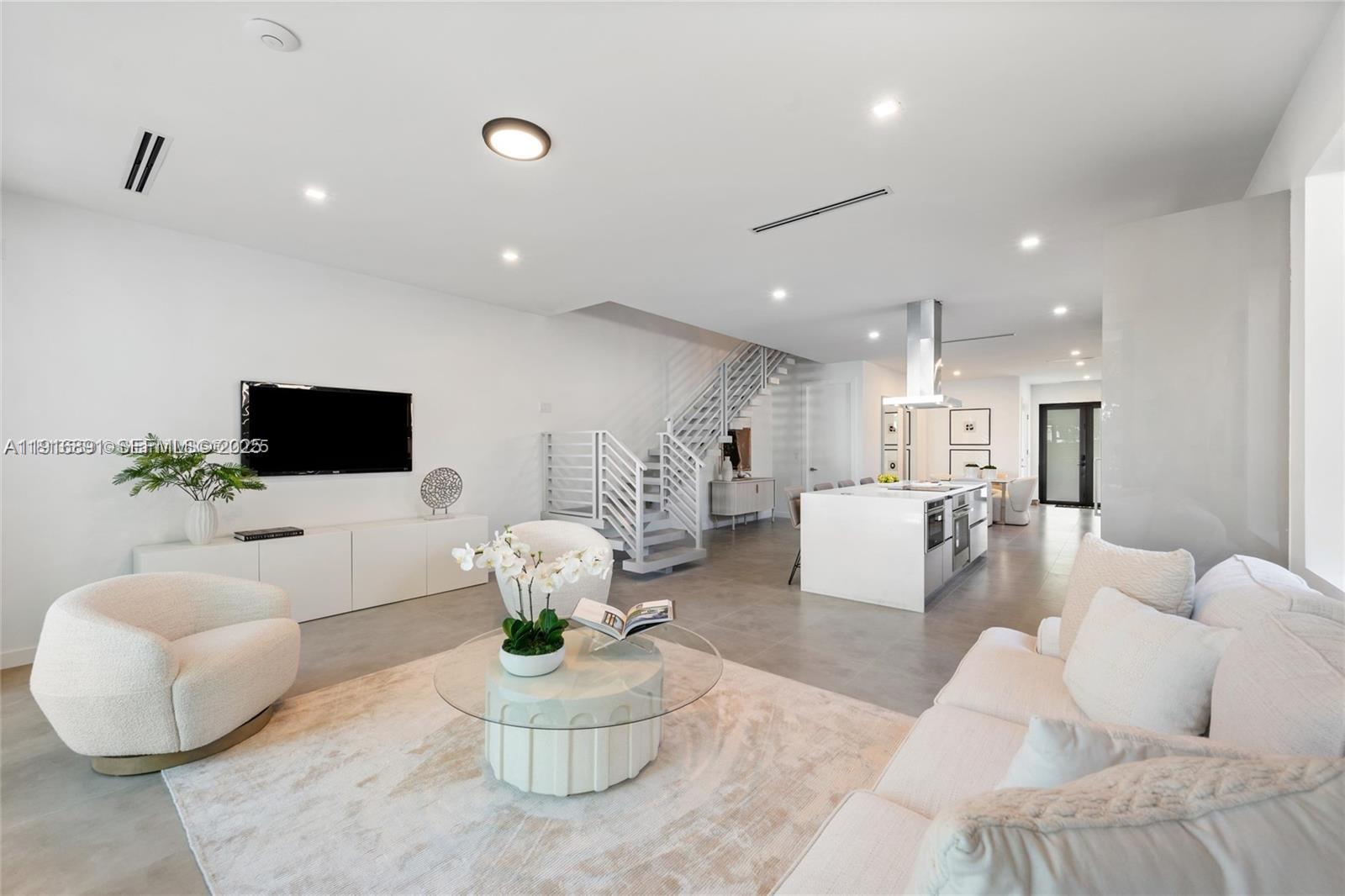 1533 Southwest 22nd Terrace Miami, FL 33145 - Photo 4 of 24 a living room with furniture or couch and a potted plant