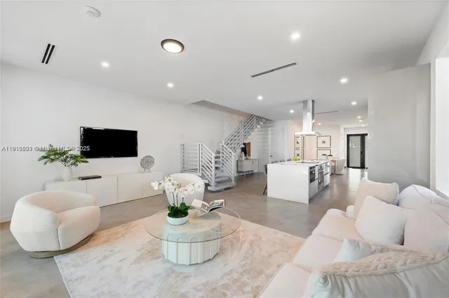 a living room with furniture or couch and a potted plant