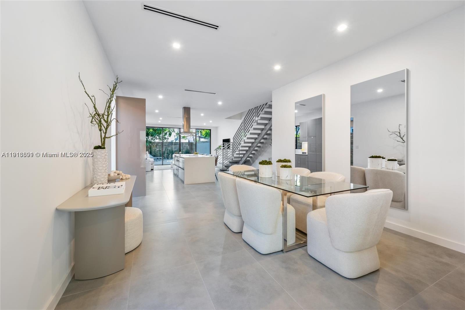 1533 Southwest 22nd Terrace Miami, FL 33145 - Photo 10 of 24 a living room with furniture and a large mirror