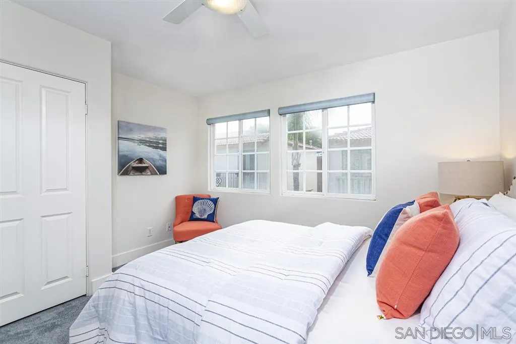 930 10th Street Coronado, CA 92118 - Photo 12 of 25 a bedroom with a bed and a large window