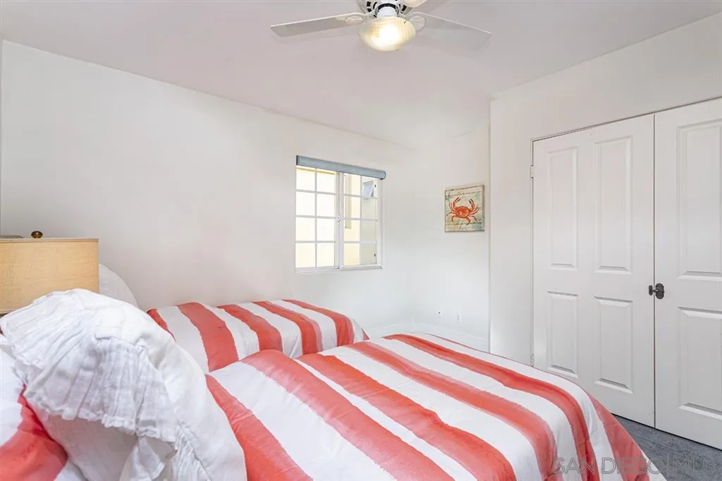 930 10th Street Coronado, CA 92118 - Photo 13 of 25 a bedroom with a bed and a window