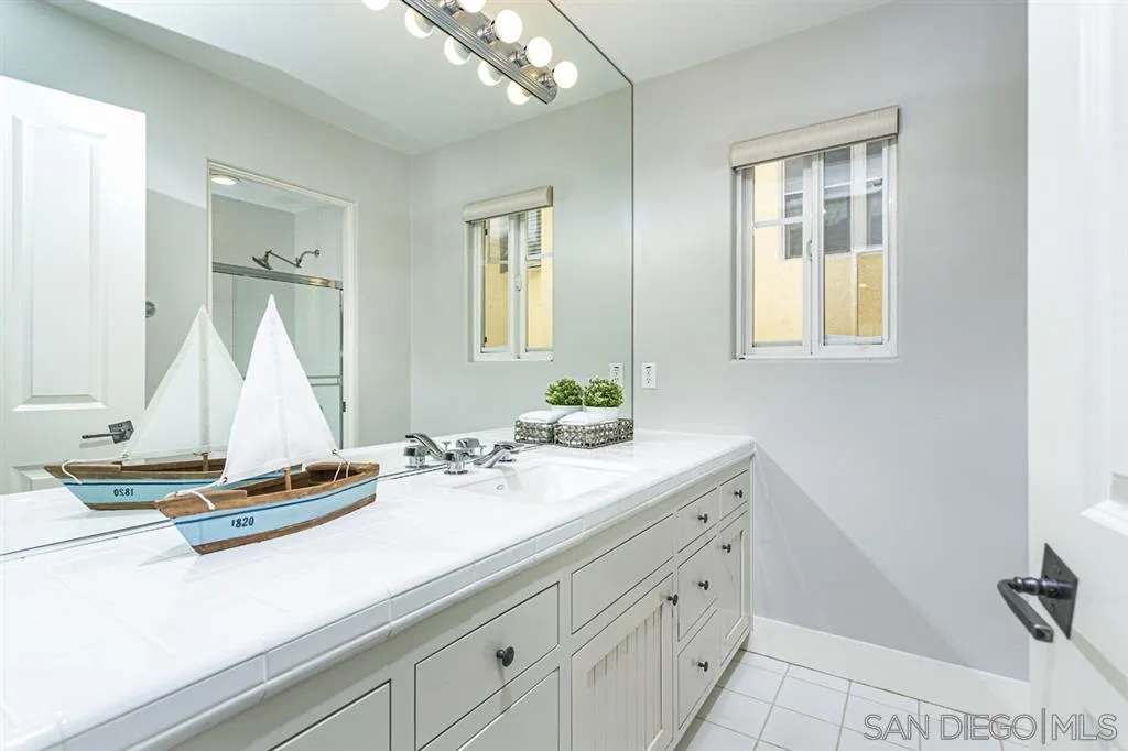 930 10th Street Coronado, CA 92118 - Photo 14 of 25 a bathroom with a sink and a mirror