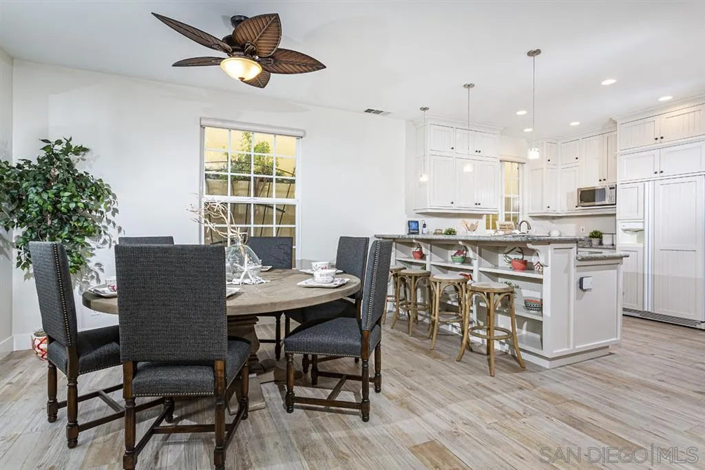 930 10th Street Coronado, CA 92118 - Photo 2 of 25 a view of a dining room with furniture and a potted plant