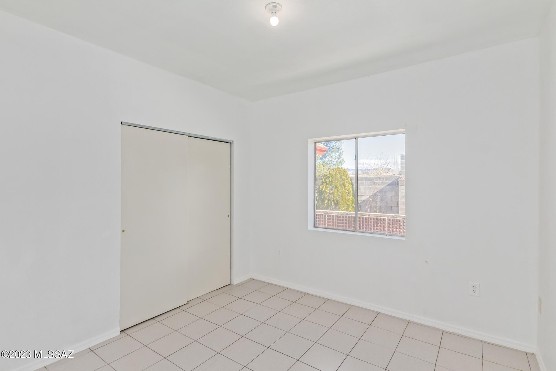 417 Dock Street Rio Rico, AZ 85648 - Photo 21 of 34 an empty room with windows