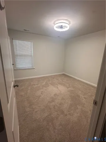 en empty room with windows