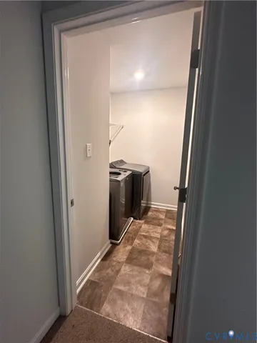 a view of a kitchen from a hallway