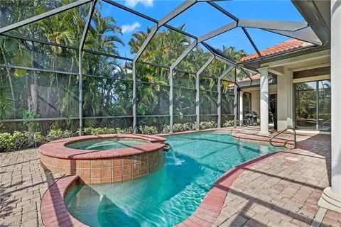 a view of a house with swimming pool and porch