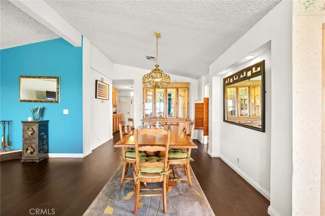 a kitchen with stainless steel appliances a sink a stove and a microwave