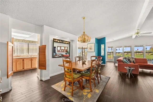 a view of a kitchen with a sink a stove and a window