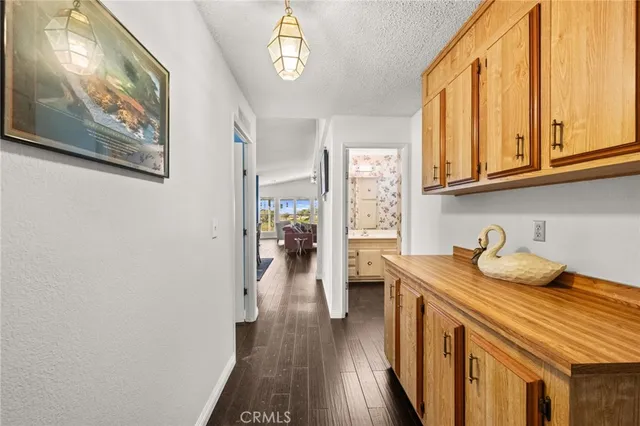 a bathroom with a bathtub a mirror a vanity and a shower