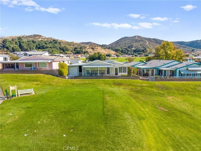 a view of a pathway both side of house