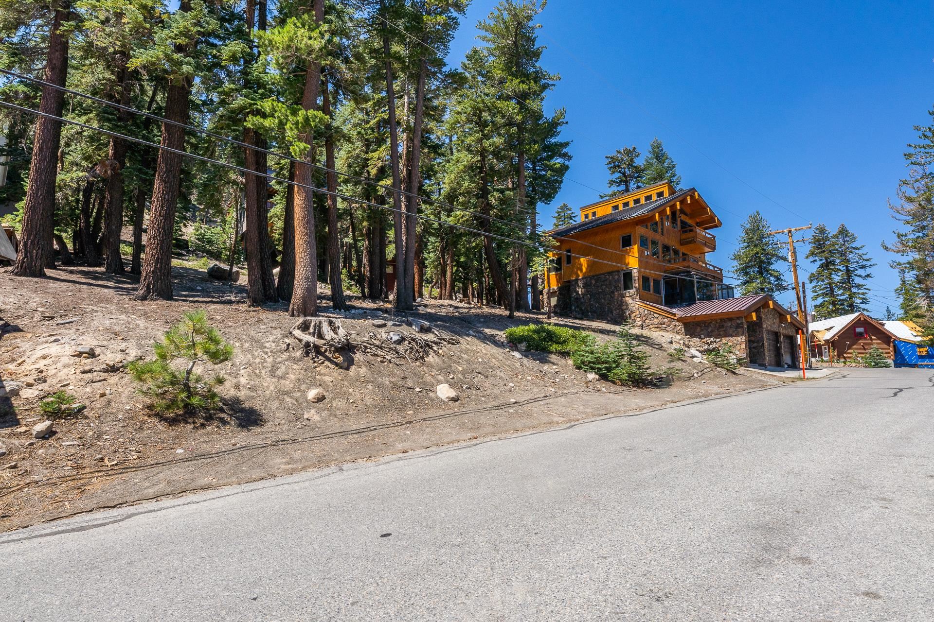 381 John Muir Road Mammoth Lakes, CA 93546 - Photo 2 of 23 a view of a house with a yard and sitting area