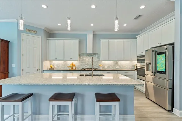 a bathroom with a granite countertop sink a toilet and a mirror