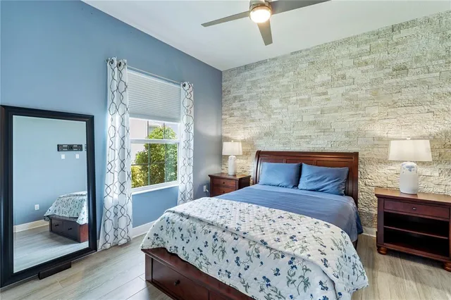 a view of a backyard with table and chairs under an umbrella