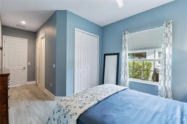 a view of a patio with couches table and chairs and potted plants