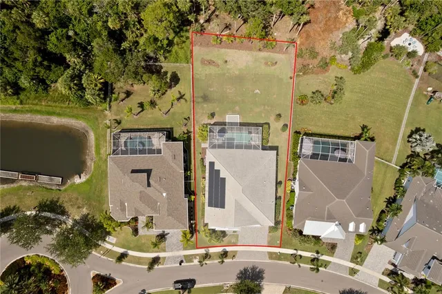 a bedroom with a large bed and wooden floor