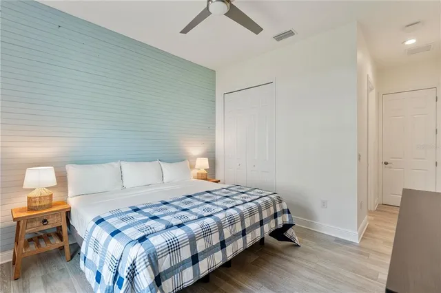 a view of a house with a yard covered in snow