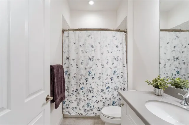 a view of tennis court with houses