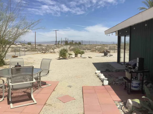 a view of a terrace with seating area