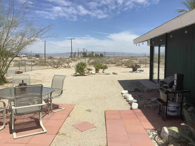 a view of a terrace with seating area