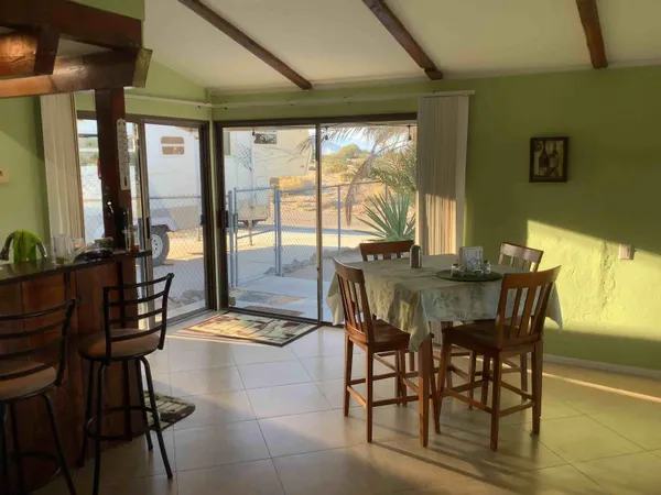 a view of a dining room with furniture window and outside view