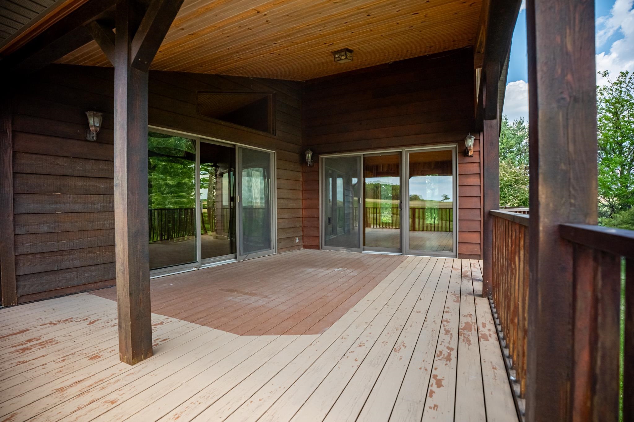14578 Center Road Durand, IL 61024 - Photo 6 of 99 a view of backyard with a deck and wooden floor
