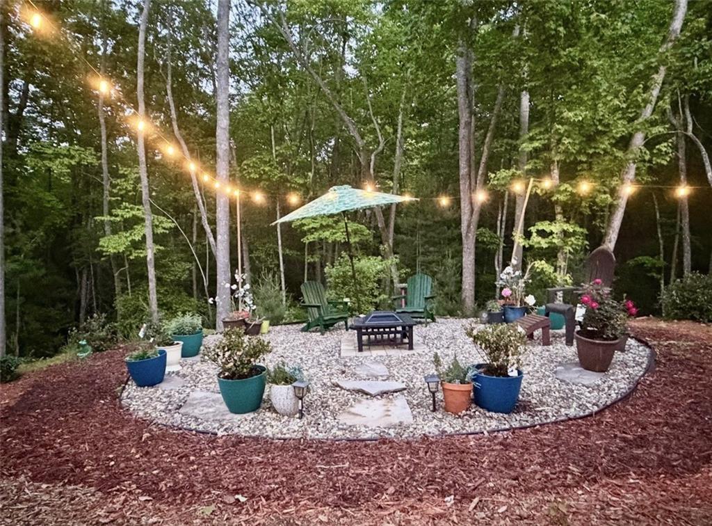 191 Oakwood Road Blairsville, GA 30512 - Photo 37 of 43 a view of a backyard with sitting area and furniture