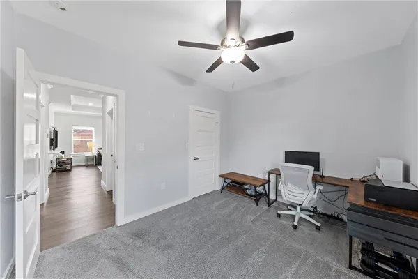 a view of a livingroom with a workspace