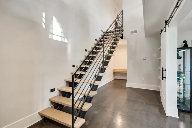 a view of entryway with stairs and wooden floor