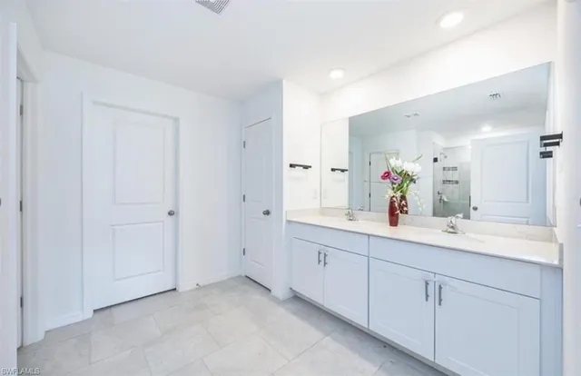 a bathroom with a sink and a mirror