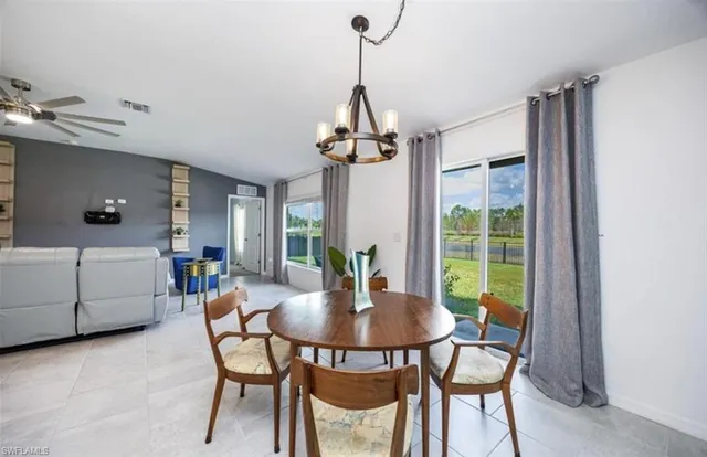 a dining room with furniture and window