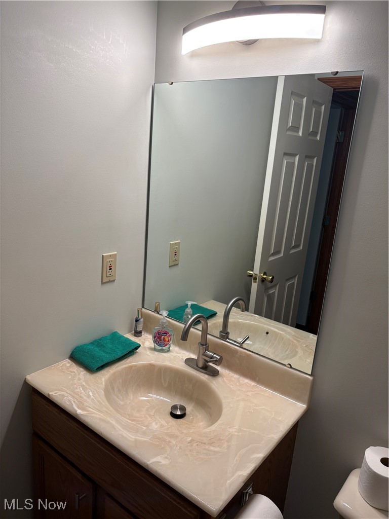 6695 Clingan Road, Unit 24 Youngstown, OH 44514 - Photo 20 of 26 Bathroom with vanity and toilet